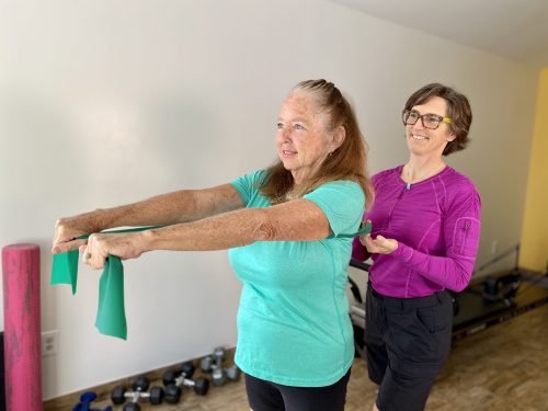 Tiger helping a woman stretch